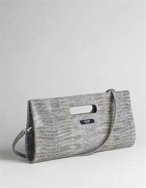 does michael kors use fake snakeskin clutch|michael kors bag scam.